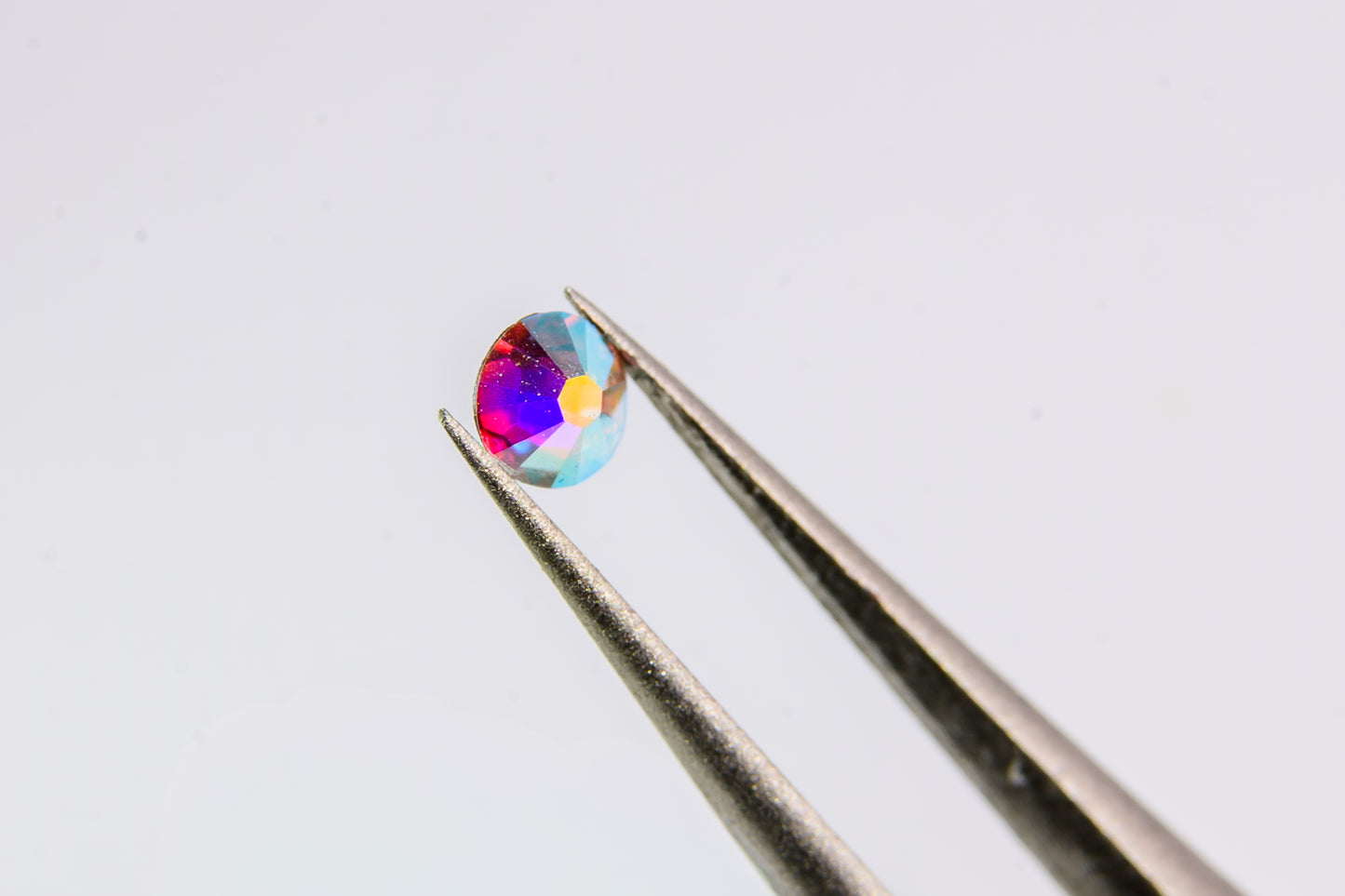 Okrągłe diamenciki Swarovski polaryzujące AB 100szt