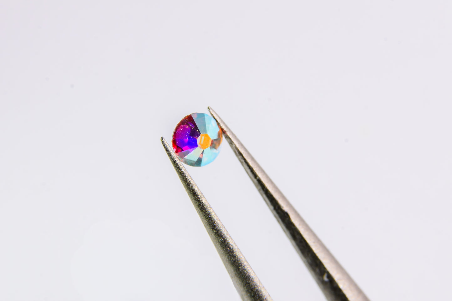 Okrągłe diamenciki Swarovski polaryzujące AB 100szt